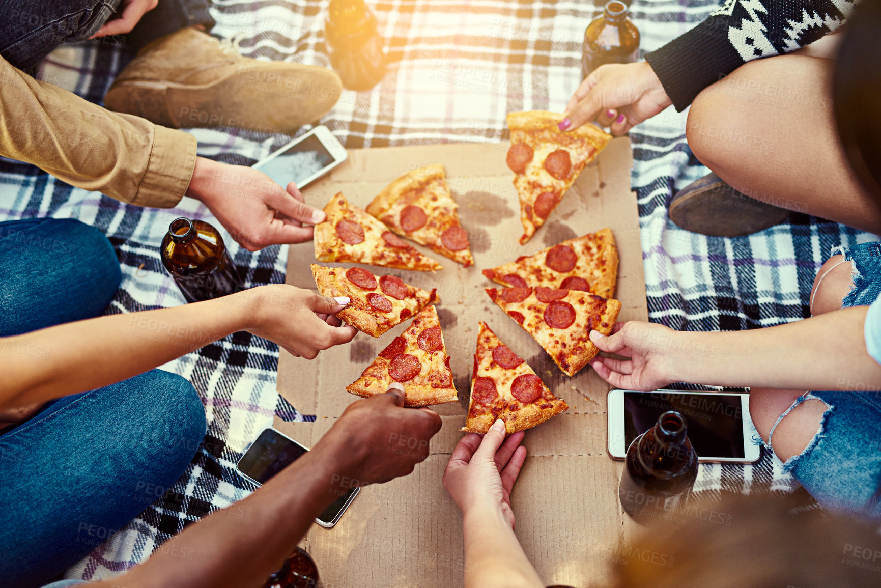 Buy stock photo Hands, friends and pizza outdoor for picnic while hanging out, chilling and bonding together with drinks. Above, hungry and people with fast food in park for eating lunch, brunch and dinner for peace