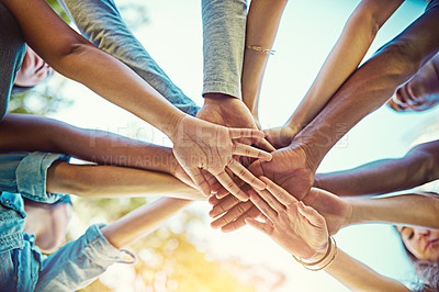 Buy stock photo Cropped shot of a group of friends with their hands piled on top of each other