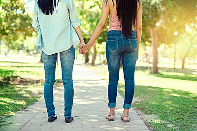 Buy stock photo Back view, lesbian couple and holding hands in nature for walking, bonding and adventure outdoors. Women, dating and romantic relationship in Italy for vacation, holiday and time together in park