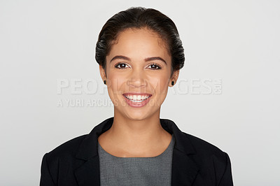 Buy stock photo Studio portrait of a confident young businesswoman against a grey background