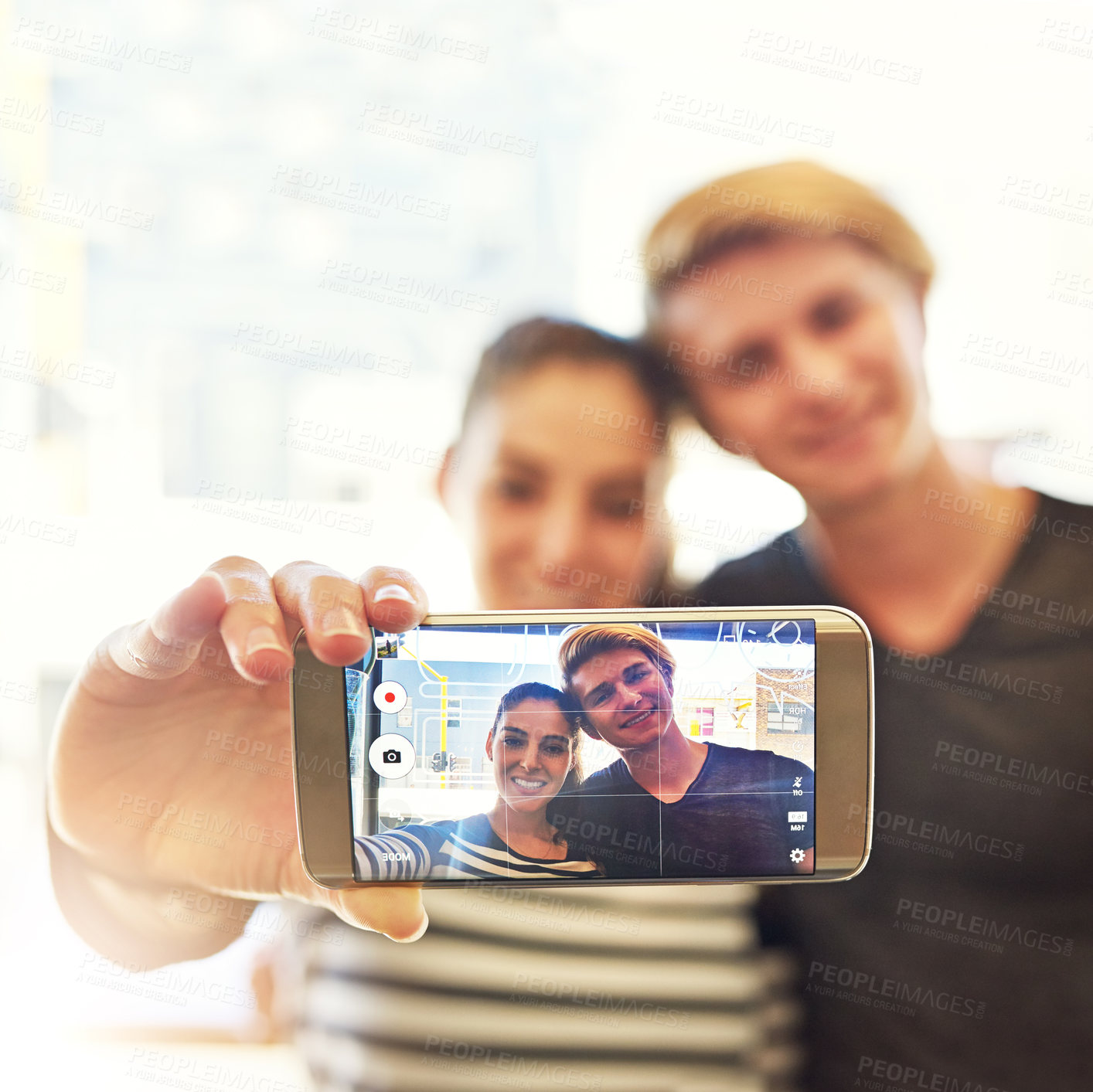 Buy stock photo Shot of two college students posing for a selfie together in a cafe