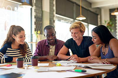 Buy stock photo Shot of a group of young friends having a study session in a cafe