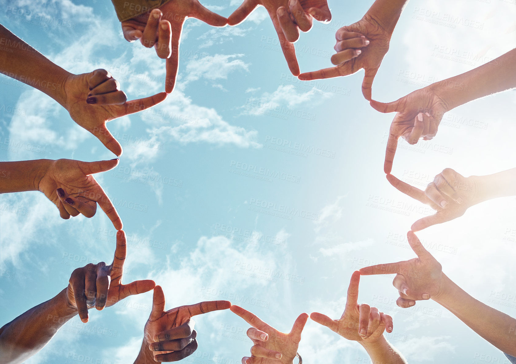 Buy stock photo Cropped shot of a group of friends joining their fingers to make peace signs