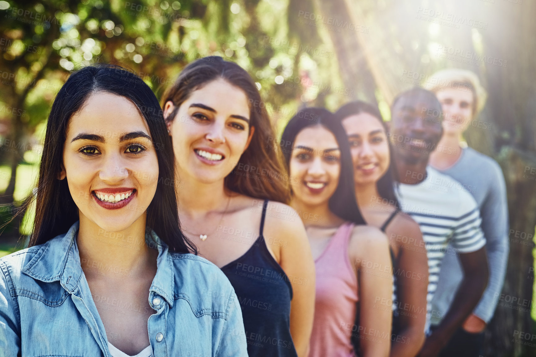 Buy stock photo Portrait, group and friends in park, sunshine or happiness with smile, bonding together or social gathering. People, diversity or men with women, nature or chilling with weekend break, playful or fun