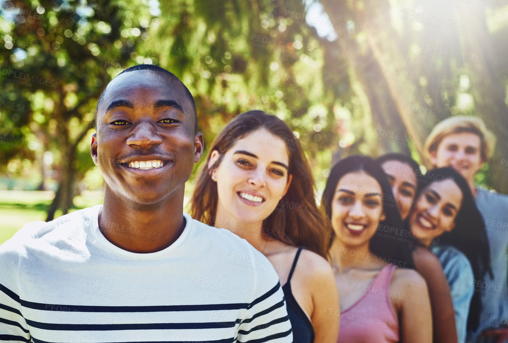 Buy stock photo Friends, row and portrait of people in park for bonding, community and relax together outdoors. Nature, happy and men and women in line for university, college diversity and studying on campus