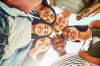 Buy stock photo Portrait of a group of young friends huddled together in solidarity