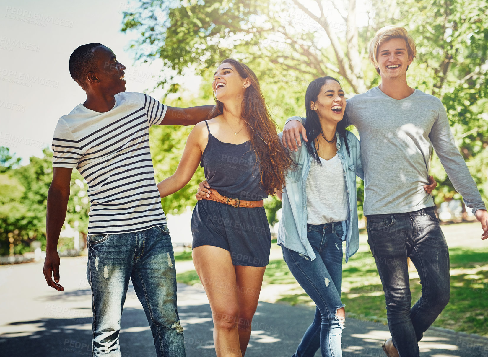 Buy stock photo Diversity, team and happy friends laugh outdoor together for support, joke and solidarity in summer nature. Group, people and community of students at park for trust, hug and funny at university