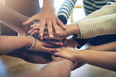 Buy stock photo Shot of a group of unidentifiable friends joining their hands in solidarity