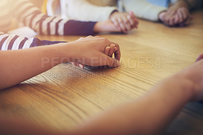 Buy stock photo Shot of a group of unidentifiable friends joining their hands in solidarity