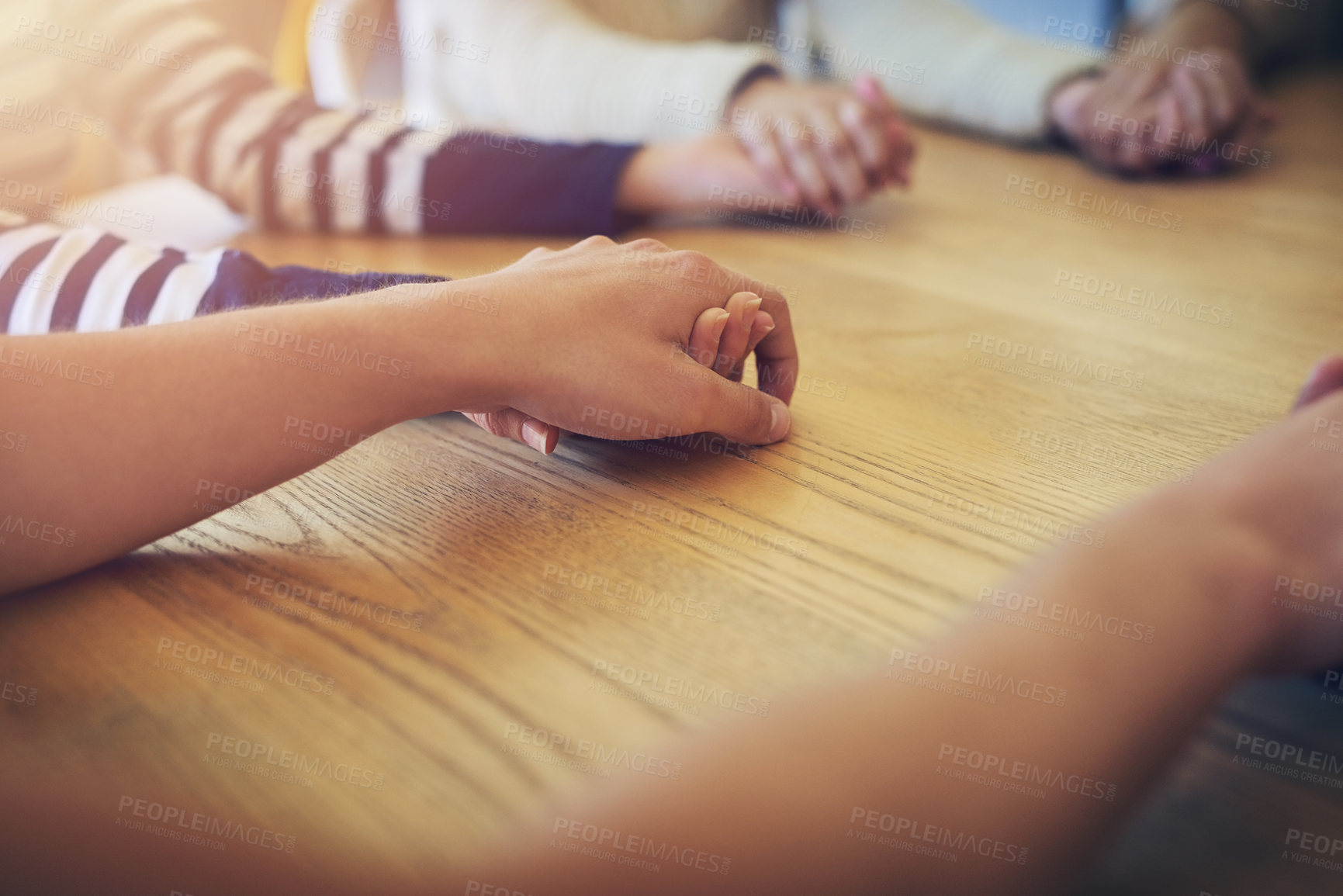 Buy stock photo Shot of a group of unidentifiable friends joining their hands in solidarity