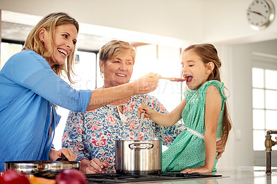 Buy stock photo Shot of a multi generational family cooking together at home