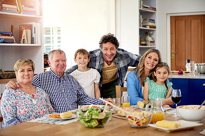 Buy stock photo Portrait of a multi generational family enjoying a meal together at home