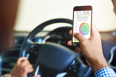 Buy stock photo Cropped shot of an unidentifiable man using a cellphone while driving a car