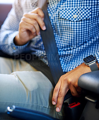 Buy stock photo Cropped shot of an unidentifiable man fastening his seatbelt in a vehicle