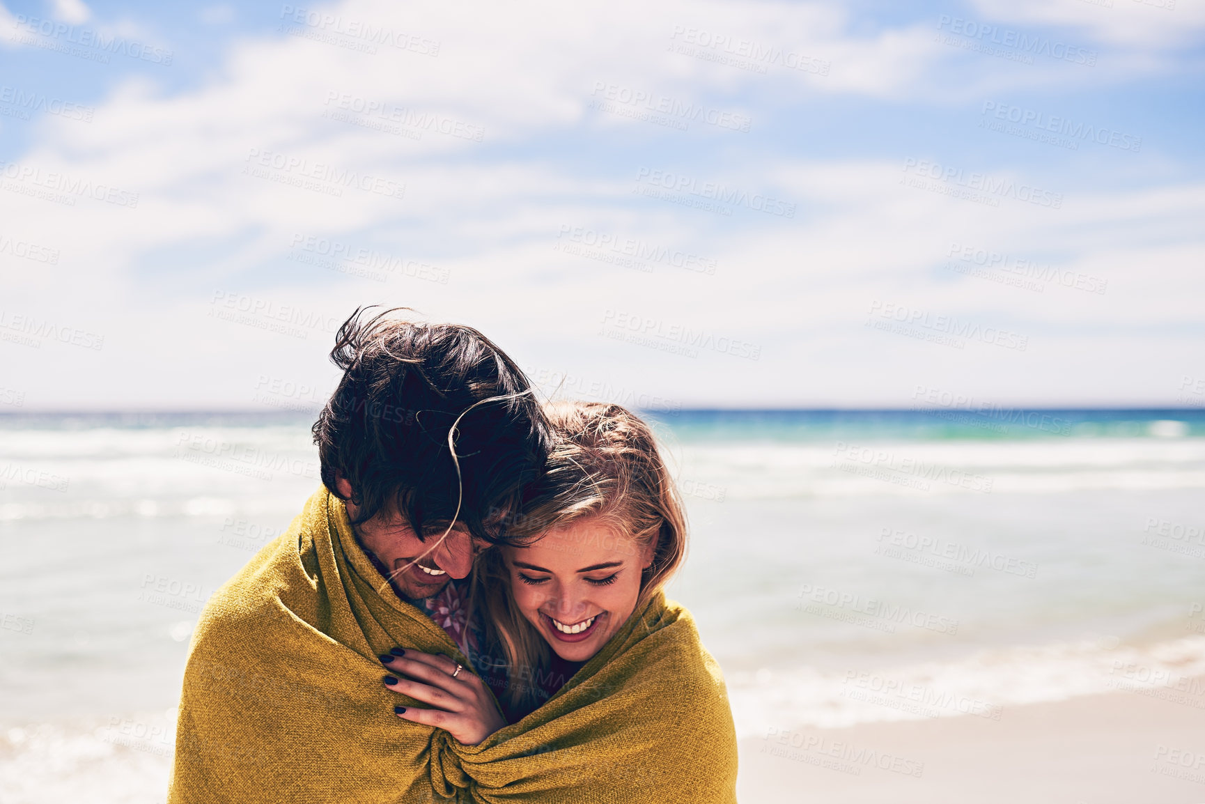 Buy stock photo Couple, towel and beach for swim and vacation, ocean and cold water plunge in sea. Happy, love and married people on holiday for honeymoon adventure, travel and waves or blue sky together with smile