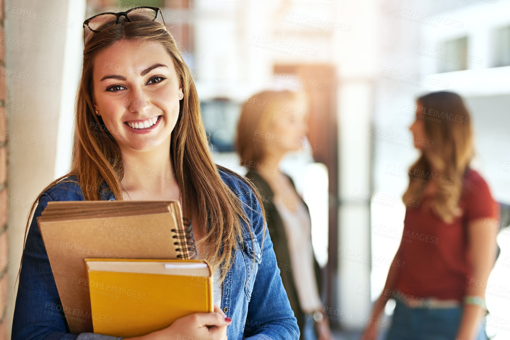 Buy stock photo Portrait, books and flare with a student woman on campus at university for education or learning. Smile, study and college with a happy young female pupil in school for an academic scholarship