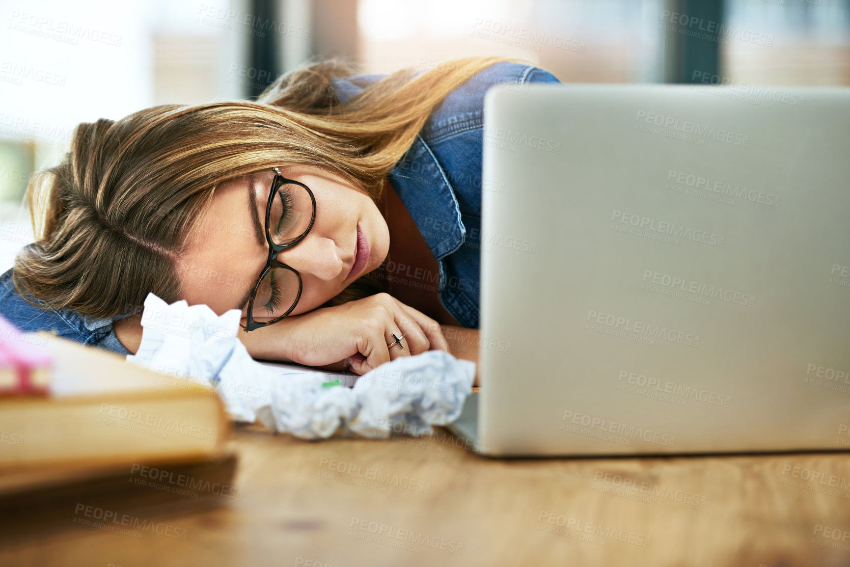 Buy stock photo University, laptop and tired girl with fatigue sleeping at campus library with burnout, risk or exhausted by assignment research. Education, stress or student with desk, nap or overwhelmed by college