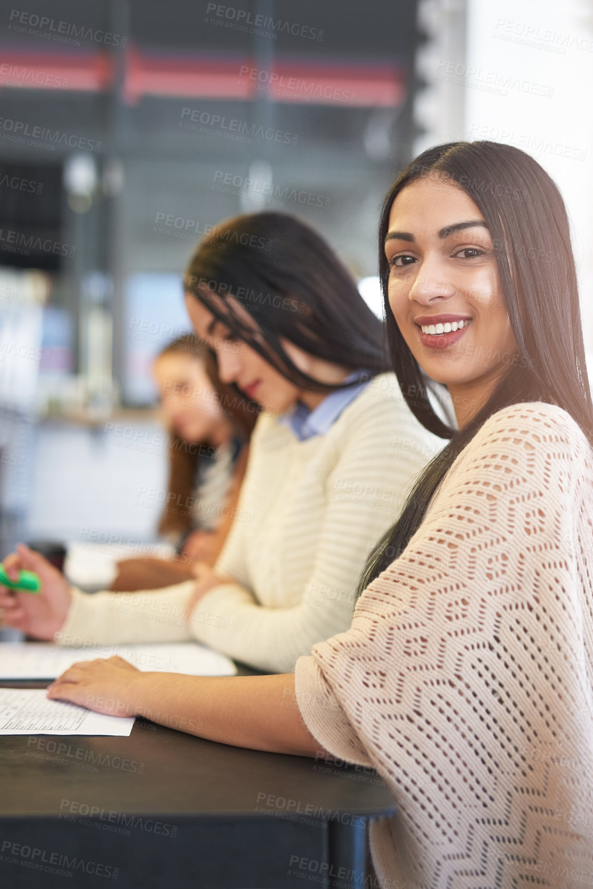 Buy stock photo Portrait, students and happy woman at table for studying, workshop and session on campus. Study group, paper notes and learning together in college for education, progress and knowledge for exams