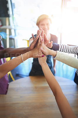 Buy stock photo Teamwork, high five and business people on table in office for collaboration, community and agreement. Startup company, diversity and above of men and women for meeting, support and team building