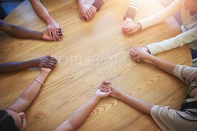 Buy stock photo Teamwork, holding hands and above of business people on table for collaboration, community and agreement. Startup company, diversity and men and women for meeting, support and team building in office