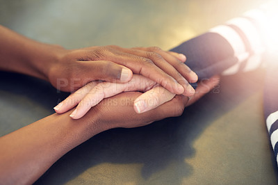 Buy stock photo Shot of an unidentifiable young man holding a friend's hands in consolation