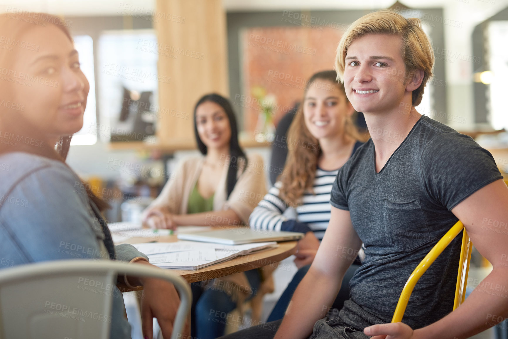 Buy stock photo Portrait of a group of happy students having a study session in a cafe
