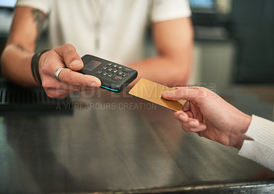 Buy stock photo Cropped shot of an unidentifiable woman making a card payment with a wireless payment device