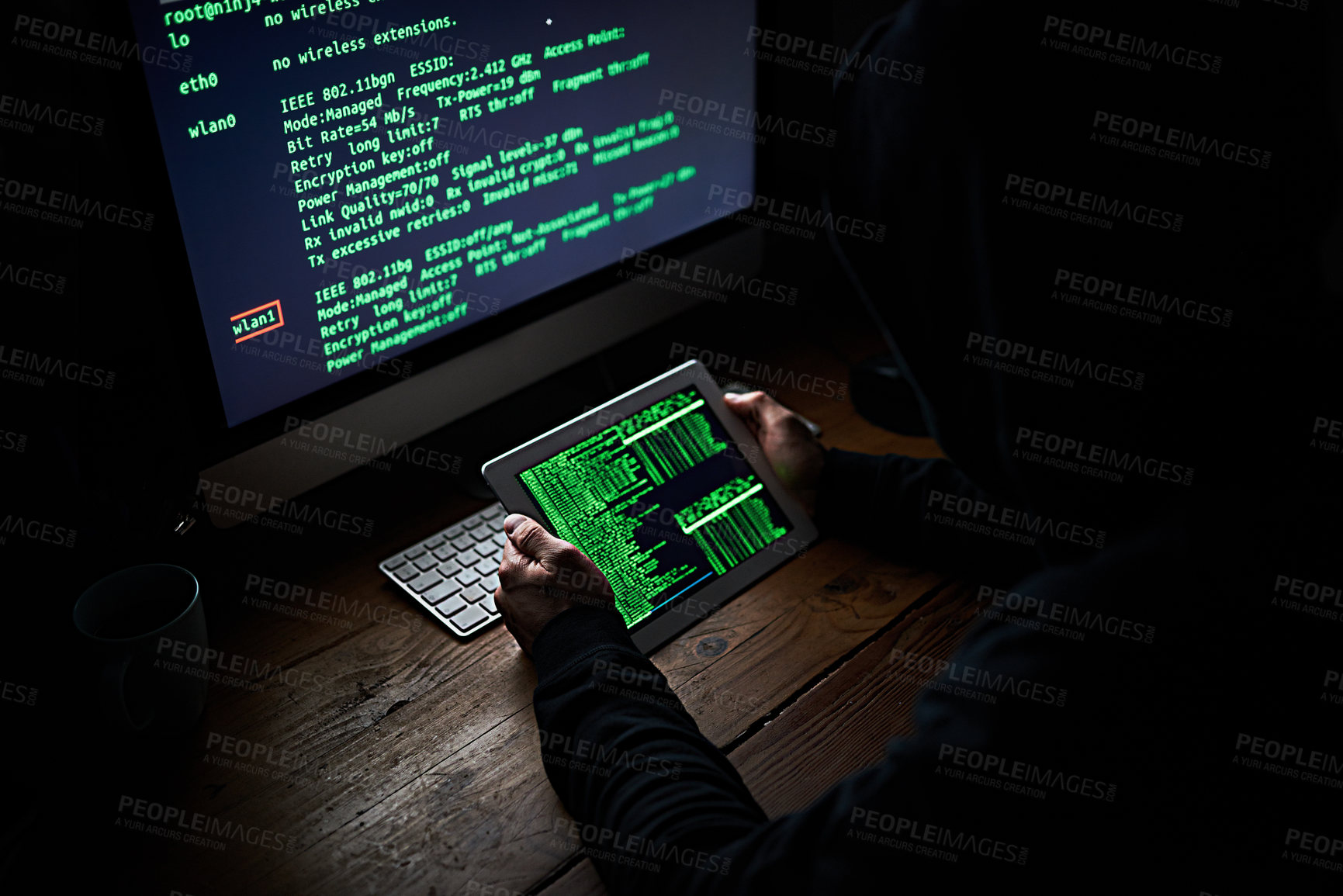 Buy stock photo High angle shot of an unidentifiable hacker using a computer late at night