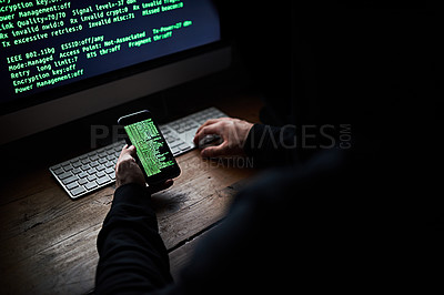 Buy stock photo High angle shot of an unidentifiable hacker using a computer late at night