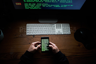 Buy stock photo High angle shot of an unidentifiable hacker using a computer late at night