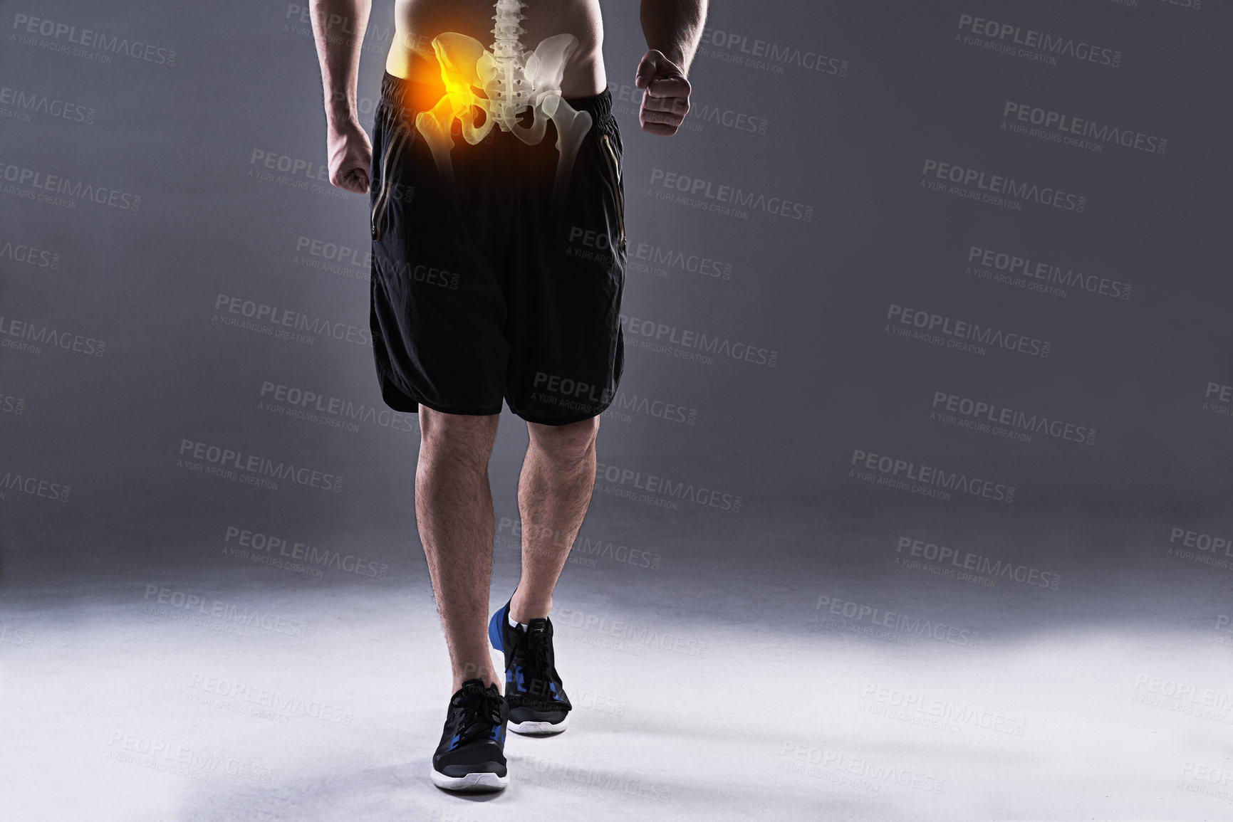 Buy stock photo Cropped shot of a young man in the studio with cgi highlighting his hip injury