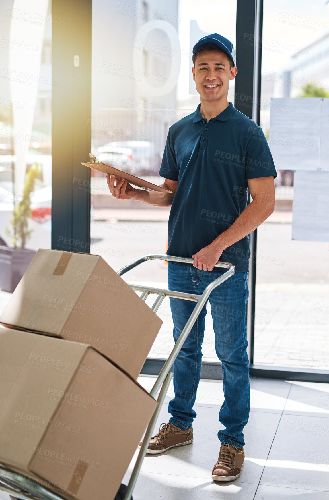 Buy stock photo Portrait of a courier making a delivery in an office