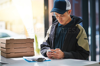 Buy stock photo Cropped shot of a young man making a pizza delivery in an office
