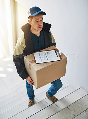 Buy stock photo Shot of a courier making a delivery in an office