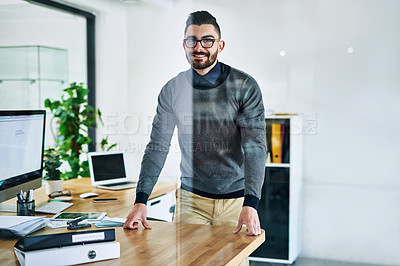 Buy stock photo Desk, office and portrait of business man with company pride, confidence and smile. Creative startup, professional agency and person by window for career, ambition and job for digital marketing