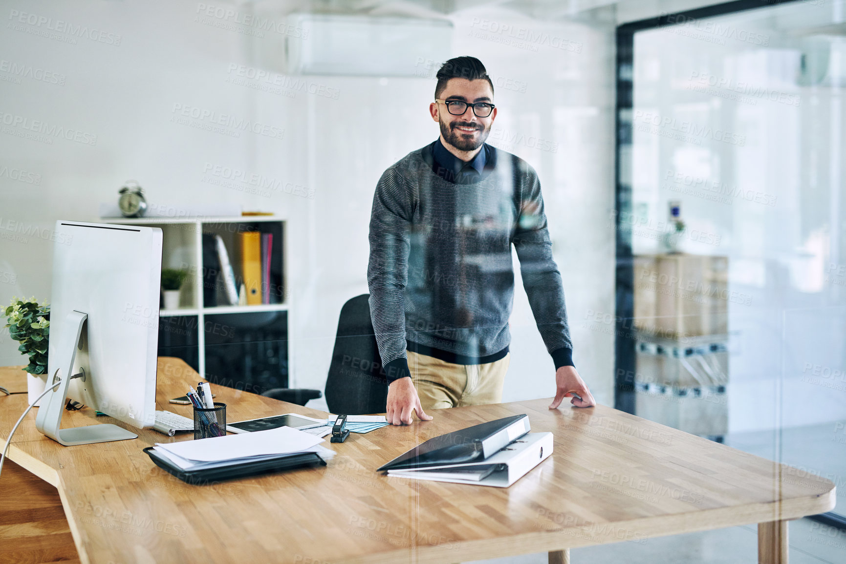 Buy stock photo Hr manager, office and portrait of business man with company pride, confidence and smile at desk. Creative startup, professional agency and person by window for career, ambition and job by glass wall