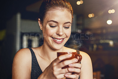 Buy stock photo Cropped shot of a young woman having a cup of coffee in a cafe