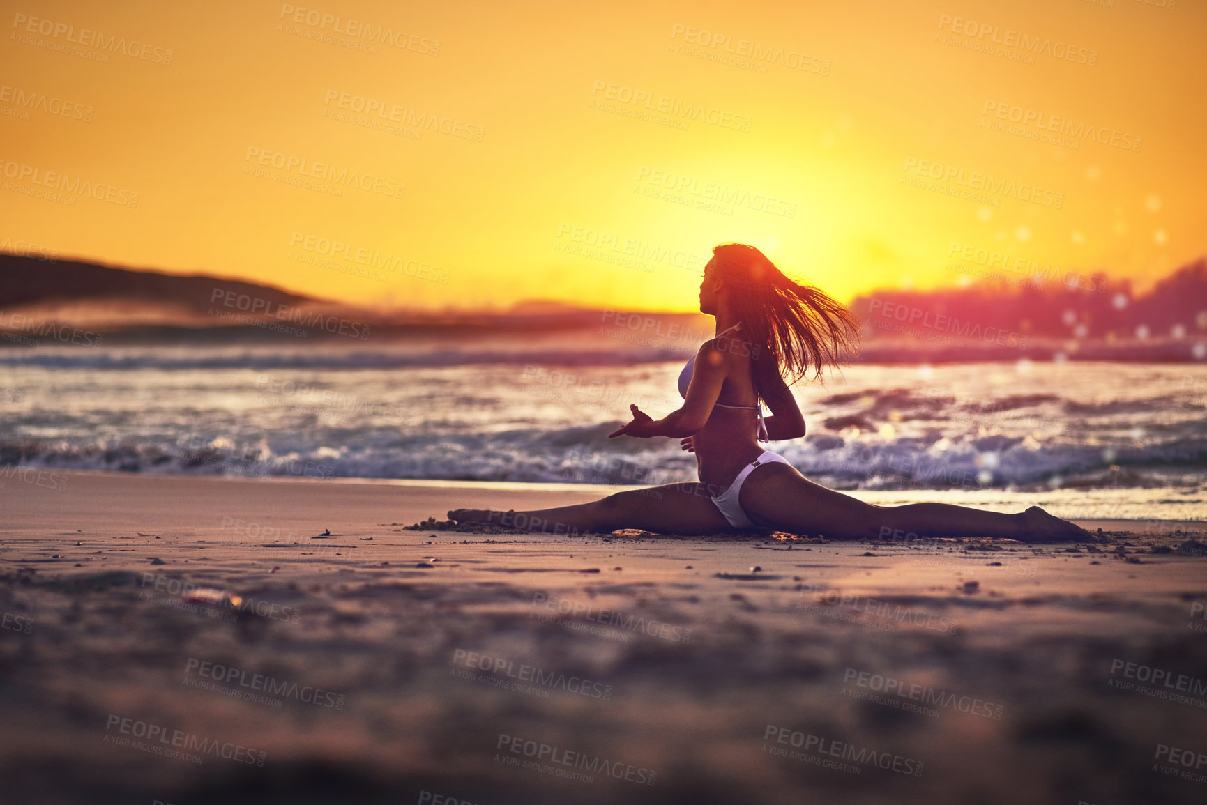 Buy stock photo Woman, stretching and splits on beach sunset, yoga and pilates exercise for energy in nature with female person. Wellness, freedom and summer vacation, seashore and water for body vitality or balance