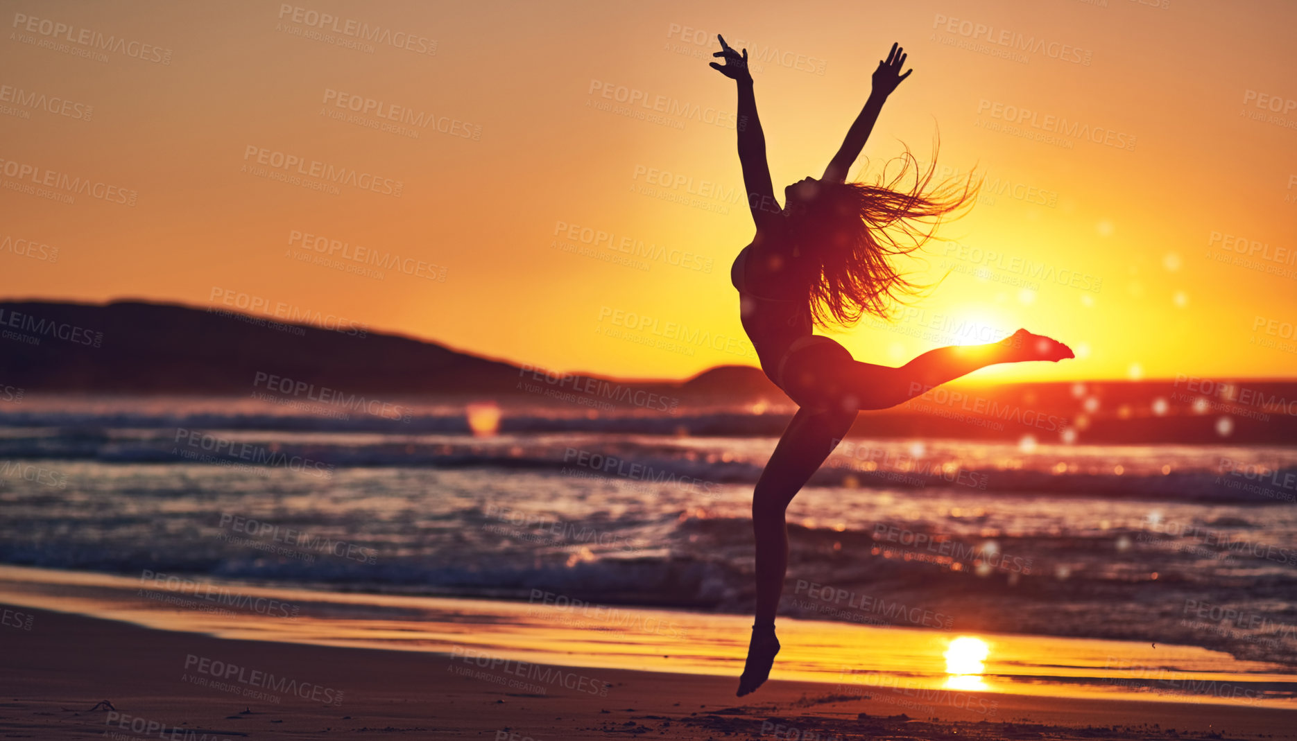 Buy stock photo Woman, sunset and jumping silhouette on seashore, contemporary dancing and energy in nature with dancer. Wellness, freedom and movement on summer vacation, beach and water with stretched body