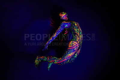 Buy stock photo Woman, neon paint and dancer jump on dark background for creative performance, splatter texture and psychedelic fantasy. Body artist, color splash and unique glow in surreal circus on mockup studio