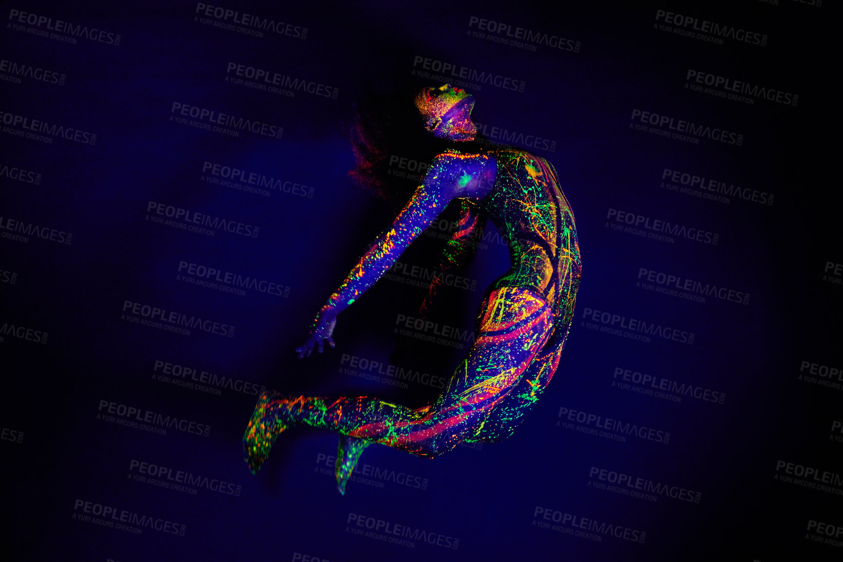 Buy stock photo Woman, neon paint and dancer jump on dark background for creative performance, splatter texture and psychedelic fantasy. Body artist, color splash and unique glow in surreal circus on mockup studio