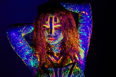 Buy stock photo Cropped shot of a young woman posing with neon paint on her face