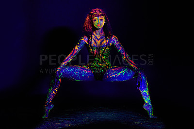 Buy stock photo Full length portrait of a young woman posing with neon paint on her face