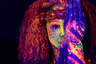 Buy stock photo Cropped portrait of a young woman posing with neon paint on her face