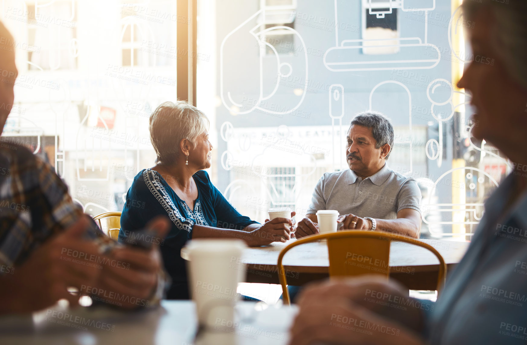 Buy stock photo Shot of a senior couple out on a date at a coffee shop