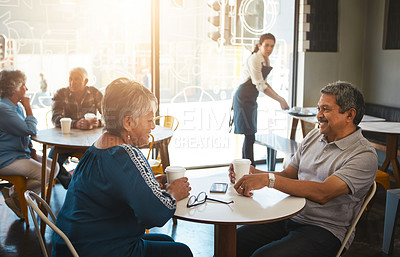 Buy stock photo Shot of a senior couple out on a date at a coffee shop