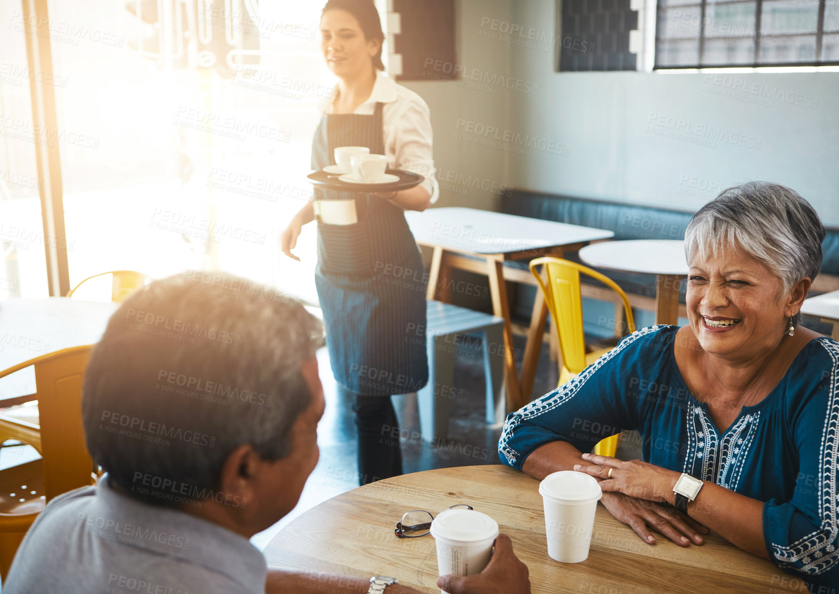 Buy stock photo Shot of a senior couple out on a date at a coffee shop