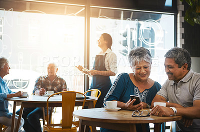 Buy stock photo Shot of a senior couple out on a date at a coffee shop
