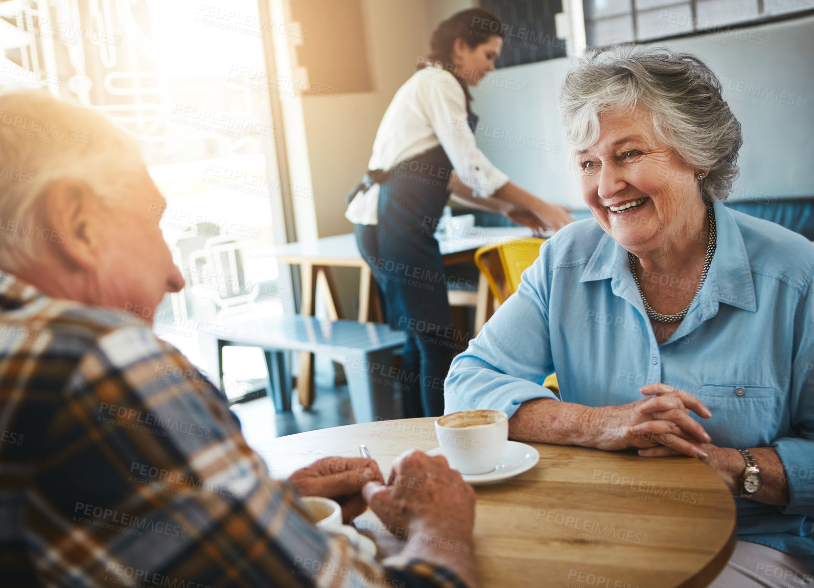 Buy stock photo Shot of a senior couple out on a date at a coffee shop