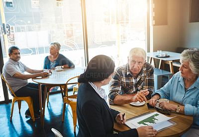 Buy stock photo Shot of a senior couple meeting up with a financial advisor